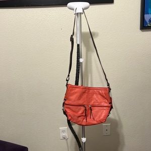 Lightly used genuine leather Nino Bossi coral cross body